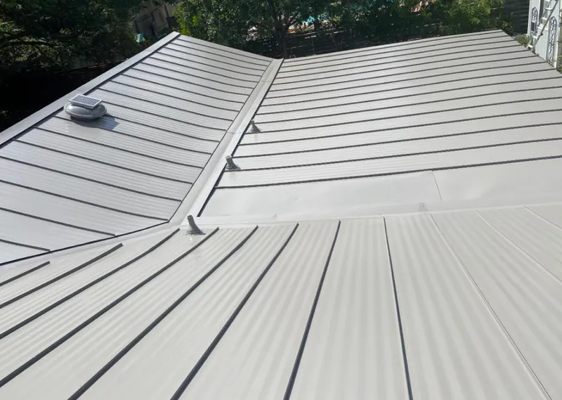 Solar attic fan installed on a metal roof for Roof Ventilation in Sachse
